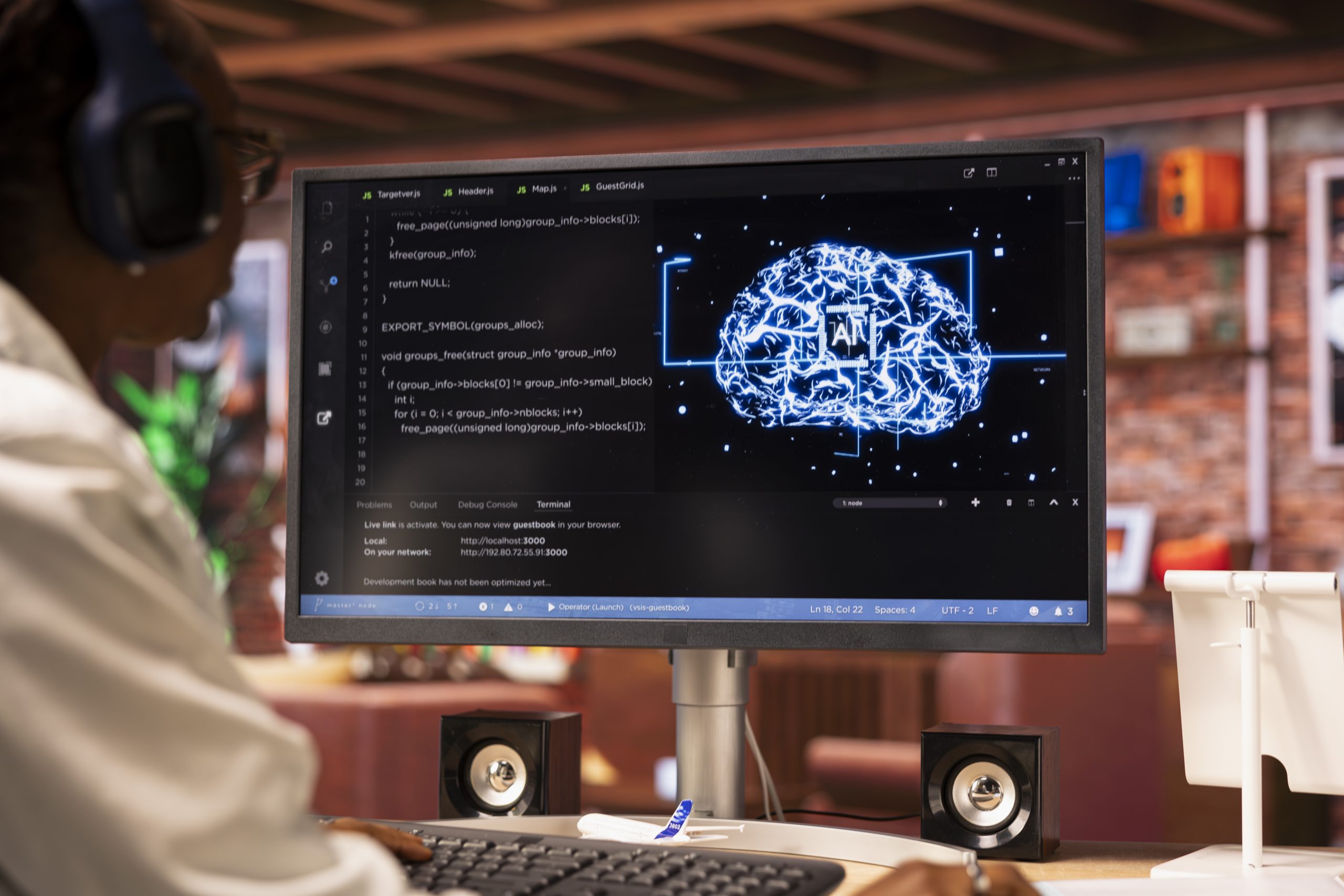 Remote employee works with AI deep learning neural networks on desktop PC